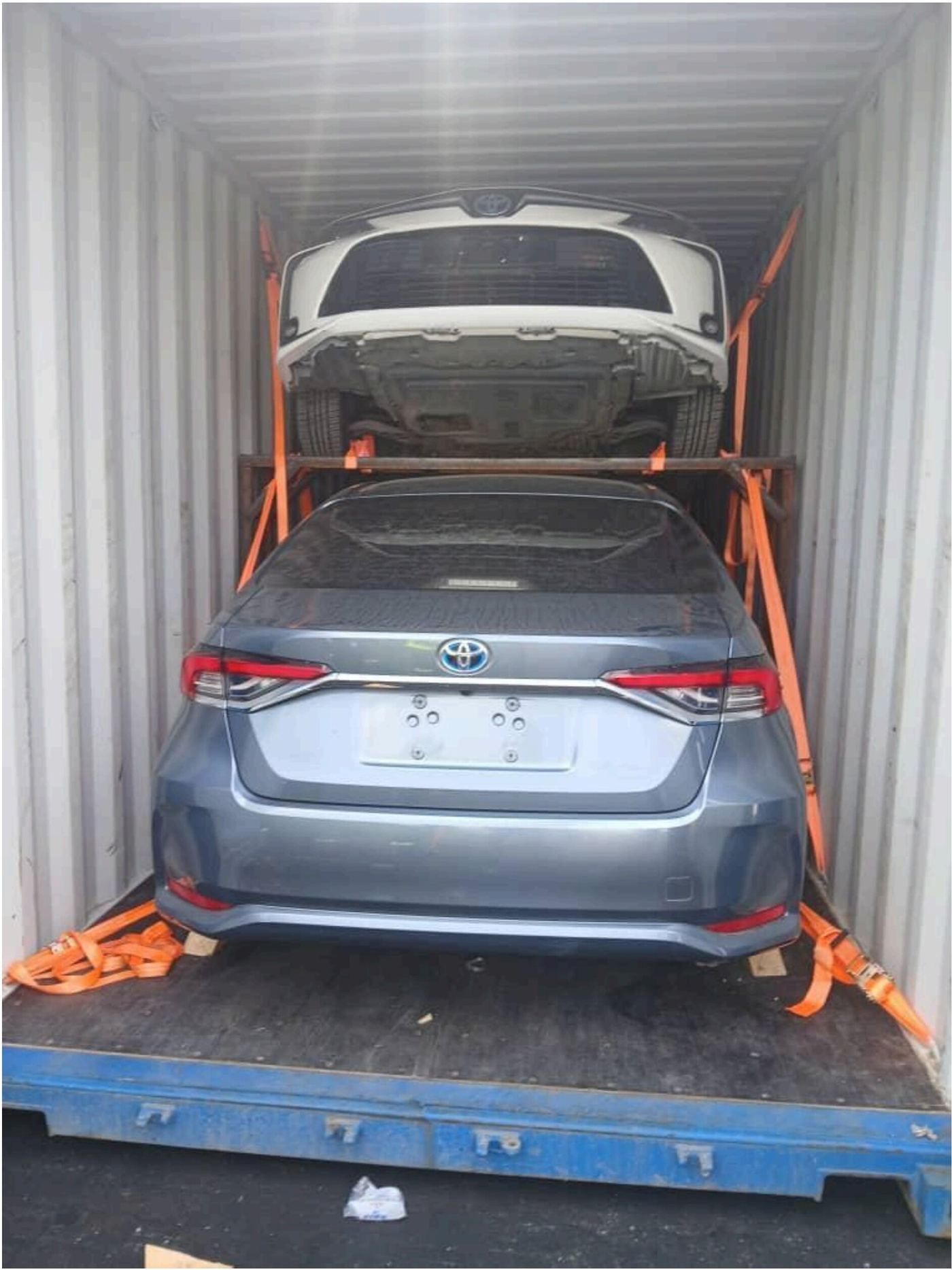 Vehicles loaded and secured inside a container